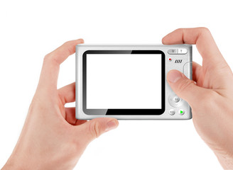 Hand holding a compact digital camera with empty LCD screen