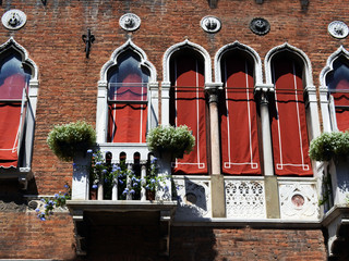 Fototapeta na wymiar Windows on historical building in Venice, Italy