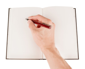 Hand holding and writing on empty notepad (notebook) isolated