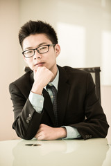 Image of young handsome confident businessman in suit