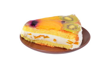 Slice of fruit cake on plate, isolated on white background