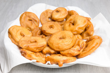 Apple fritters on glass scale