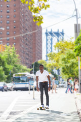 Black Boy Skating with Longboard on the Road