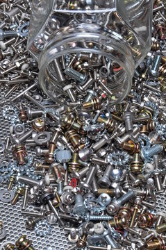 Set Of Bolts Screws And Nuts With The Glass Jar