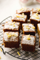 slices of a ginger parkin on a lattice for cooling.