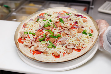 Pizza makers on a kitchen