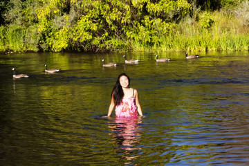 Fototapeta premium Young Attractive Japanese Woman Portrait Standing River