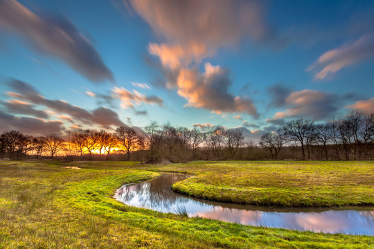 Orange Sunset over River Landscape