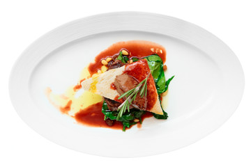 Tenderloin steak with beef terrine and spinach, isolated