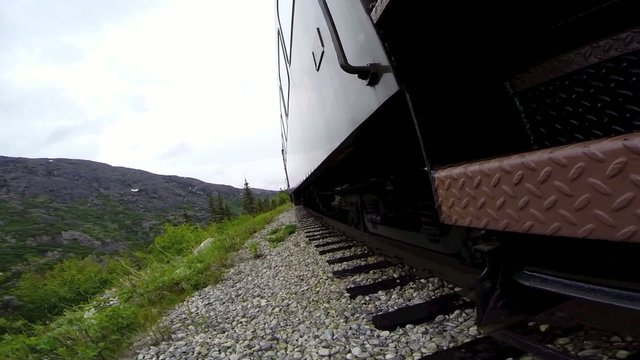 First person POV of train rolling on tracks