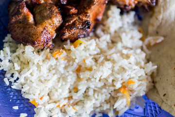 closeup of a rice plate with meat