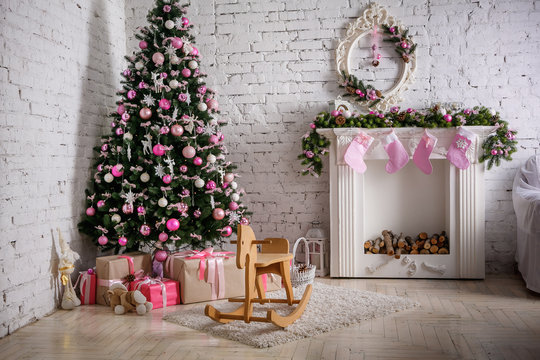 Image of chimney and decorated xmas tree with gift