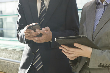 Businessmen are using electronic tablet