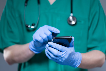 Surgeon using mobile phone