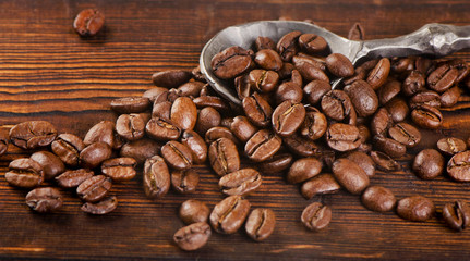 Coffee beans on  old wooden background