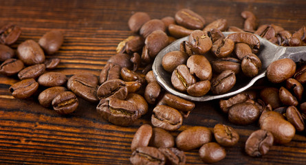 Coffee beans on a  old wooden background