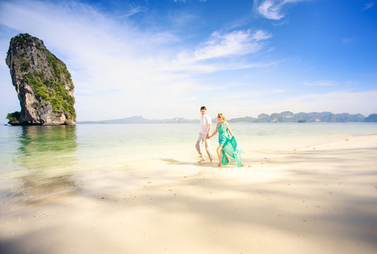 young happy asian couple on honeymoon