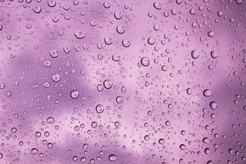 Water drops on glass background sky.
