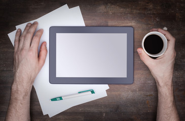 Tablet touch computer gadget on wooden table