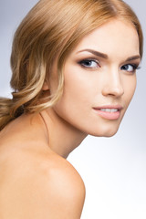 Fototapeta premium Portrait of beautiful woman, over grey