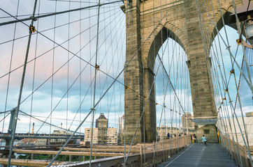 Fototapeta premium Magnificent structure of Brooklyn Bridge with sunset sky - NYC