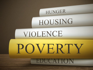 book title of poverty isolated on a wooden table