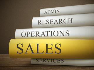 book title of sales isolated on a wooden table