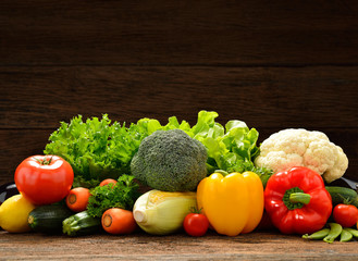 Vegetables and fruits on old wooden background