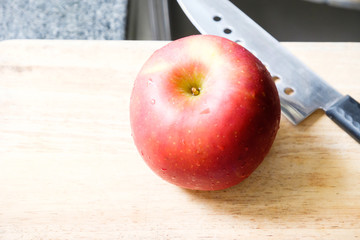 red apple with knife