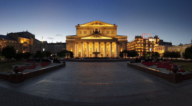 Bolshoi Theatre near illuminated buildings, square and fountains