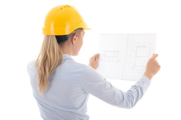 back view of business woman in yellow builder helmet holding bui