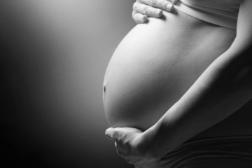 Pregnant Woman Belly. Black and white pregnant tummy closeup
