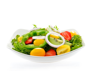Fruit and vegetable salad in a bowl isolated on white