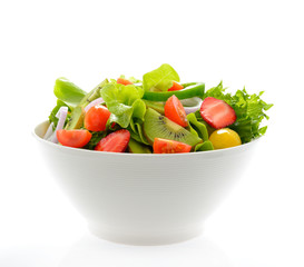 Fruit and vegetable salad in a bowl isolated on white