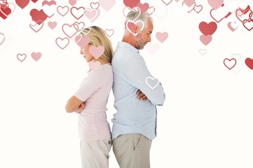 Composite image of unhappy couple not speaking to each other