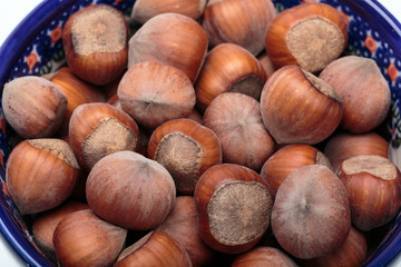 Pile of hazelnuts isolated on white background
