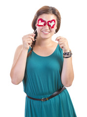 smiling teenager girl with heart shaped lollipop