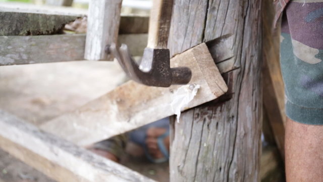 Closeup of Carpenter use equipment to repare the furniture