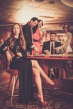Group of stylish people playing in a casino