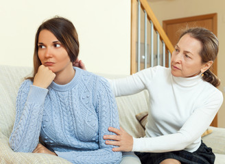 Mature woman tries asking apologies with teenage daughter