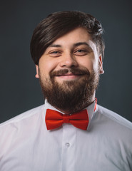 Guy in a white shirt with red tie bow