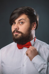 Guy in a white shirt with red tie bow