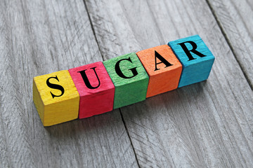 word sugar on colorful wooden cubes