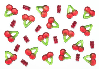 Gummy bears and cherry candies on a white background