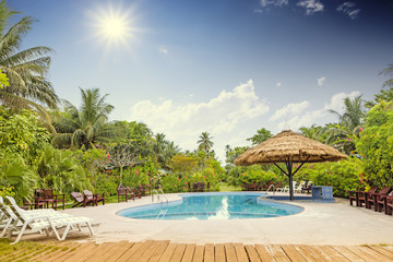 Fototapeta na wymiar Resort swimming pool with empty plank board