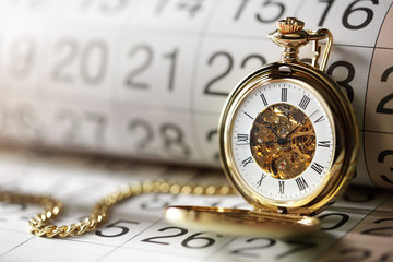 Gold pocket watch and calendar