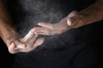 Obraz na płótnie Canvas adult man hands work with flour