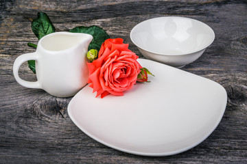 table setting with roses  on white wooden table,  rustic style