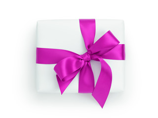 white gift box with purple ribbon bow, from above
