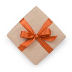 wrapped brown present box with orange ribbon bow